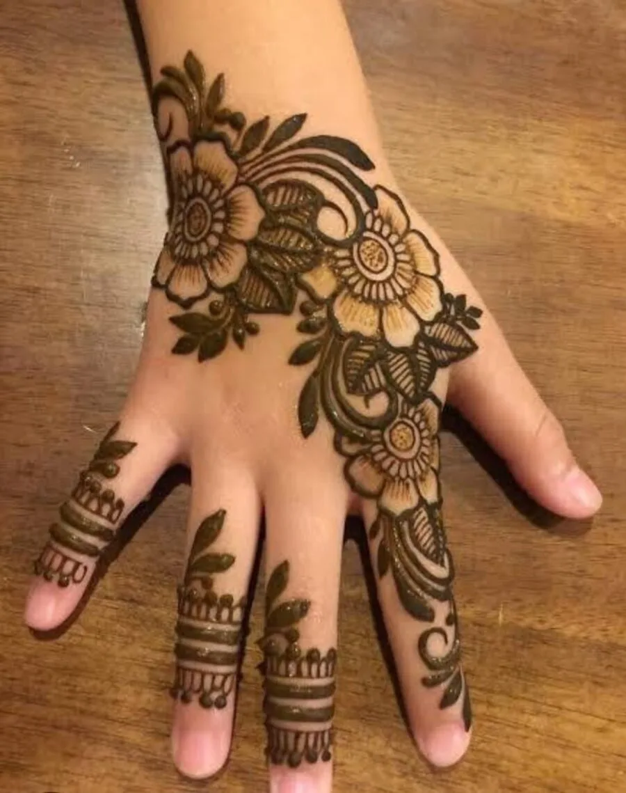 Henna art — intricate mehndi design on hand